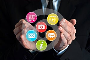 Businessman showing colorful virtual icons