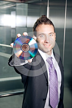 Businessman showing disk