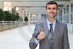 Businessman showing a double thumbs up