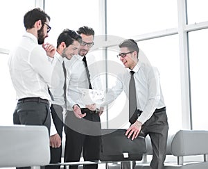 Businessman showing employees the signed contract