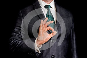 Businessman showing gesture OK