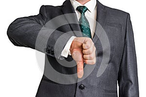 Businessman showing gesture with thumb down photo
