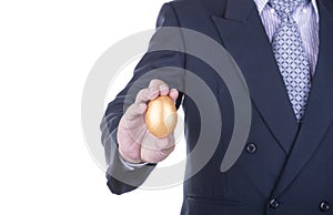 Businessman showing golden egg. concept business