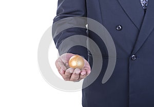 Businessman showing golden egg. concept business