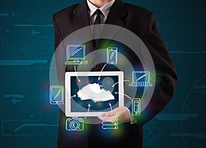 Businessman showing hand drawn cloud computing