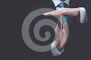 Businessman showing hand sign ,pause or request a break ,time out gesture sign ,time for a break ,Gestures asking for time to