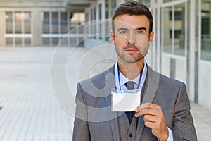 Businessman showing his credentials with space for copy