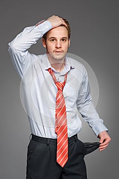 Businessman showing his empty pocket