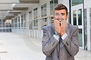 Businessman showing hysteria close up with copy space