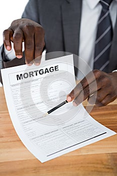 Businessman showing mortgage document