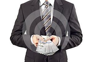 Businessman showing new hundred dollar bills