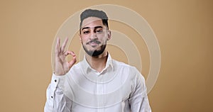 Businessman showing ok gesture with hand