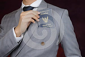 Businessman showing passport, travel aboard, business trip