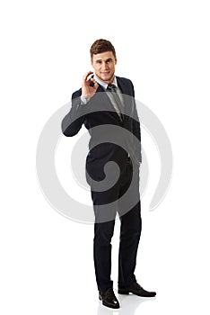 Businessman showing perfect sign.