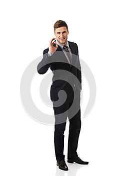 Businessman showing perfect sign.