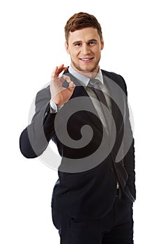 Businessman showing perfect sign.