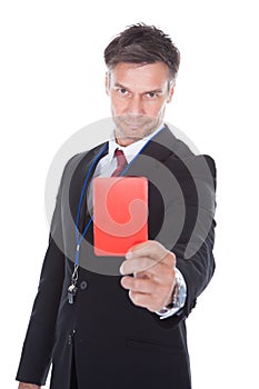 Businessman showing red card