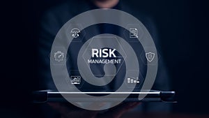 Businessman showing risk management icons. Risk analysis in Business or finance and assessment for business investment.