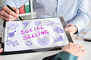 Social selling concept on a clipboard photo