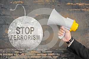 Businessman showing stop terrorism sign