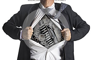 Businessman showing a superhero suit underneath machinery metal