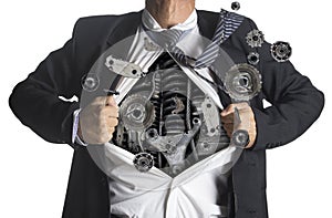 Businessman showing a superhero suit underneath machinery photo