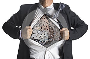 Businessman showing a superhero suit underneath machinery photo