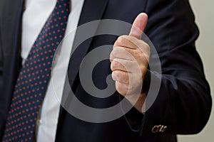 Businessman showing thumb up