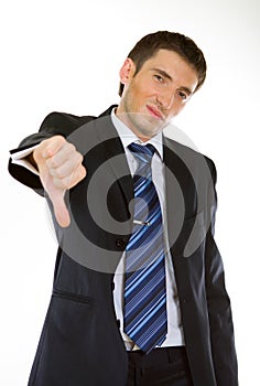 Businessman showing thumbs down