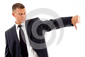 Businessman showing thumbs down gesture