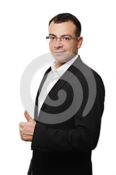 Businessman showing thumbs up in office