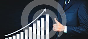 Businessman showing thumbs up sign. Growth graph. Success concept