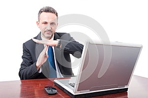 Businessman showing time out sign