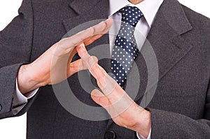 Businessman showing time out sign with hands.