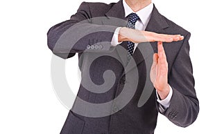 Businessman showing time out sign with hands.