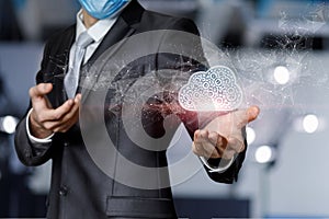 Businessman shows cloud computing on blurred background