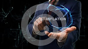 Businessman shows concept hologram Inflation