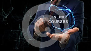 Businessman shows concept hologram Online Courses