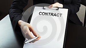 Businessman shows a contract, business contract details