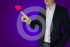 Businessman shows a finger on the heart, purple background, greeting card template, invitation card