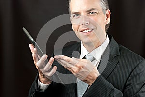 Businessman Shows Tablet