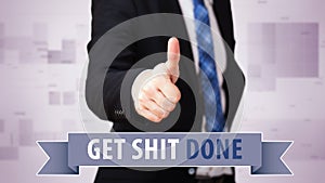 Businessman shows thumb up to `Get shit done!`