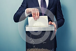 Businessman shredding documents photo