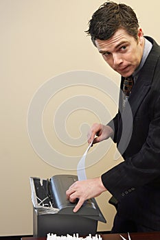 Businessman Shredding Documents