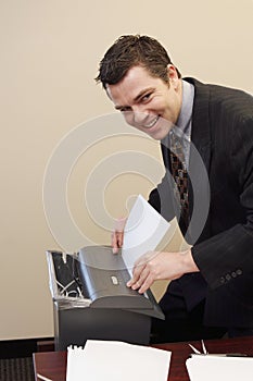 Businessman Shredding Documents