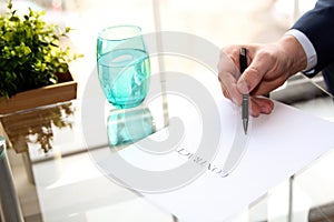 Businessman is signing a contract, business contract details.