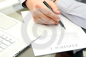 Businessman is signing a contract, business contract details.