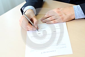 Businessman is signing a contract, business contract details