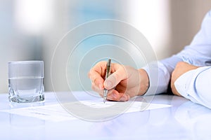 Businessman is signing a contract, business contract details