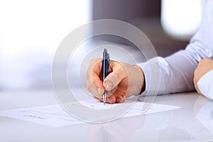 Businessman is signing a contract, business contract details